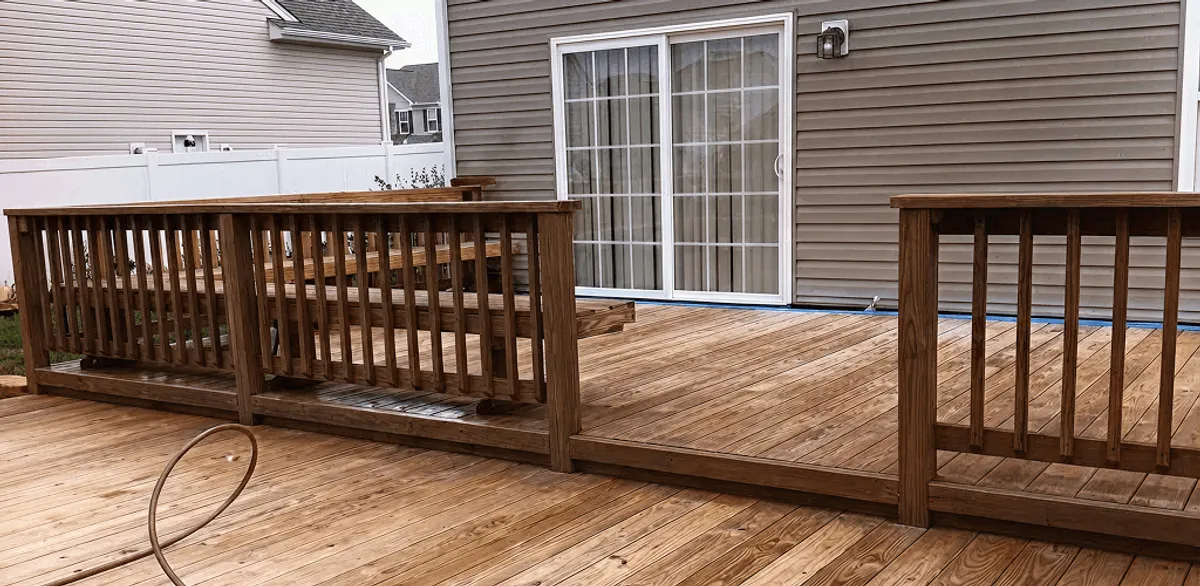 Deck sealing service protecting a backyard wood deck and railings in Santa Ana, CA