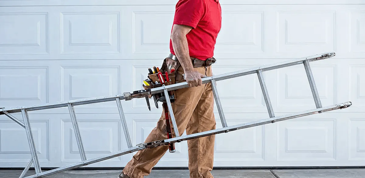 Garage door repair technician arriving with tools and ladder in Santa Ana, CA